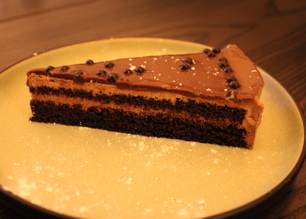  Slice of rich, layered chocolate cake with chocolate ganache served at Greek Theory, Falkirk